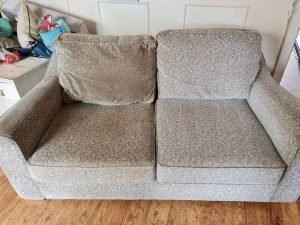 How do you clean a fabric sofa